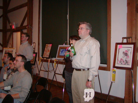Bidders are at the ready with their auction paddles.